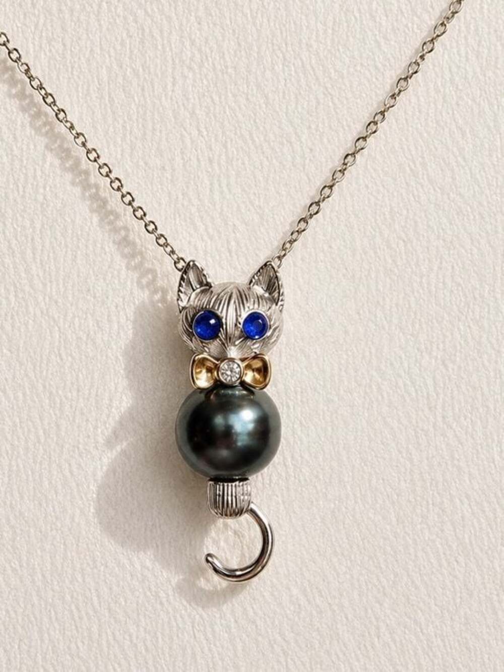 7.8mm Black Tahitian Cat Pendant Necklace with Gemstones and Gold Bow Tie